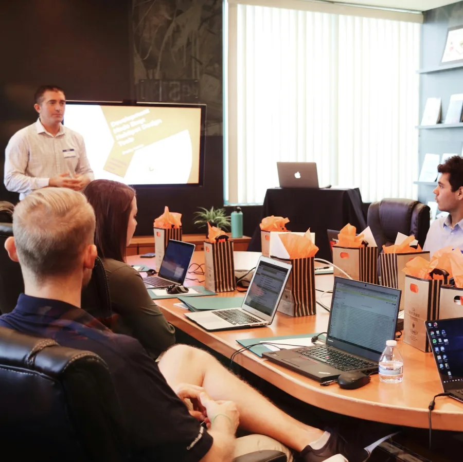 A meeting room seen from a seat towards the back, around the table