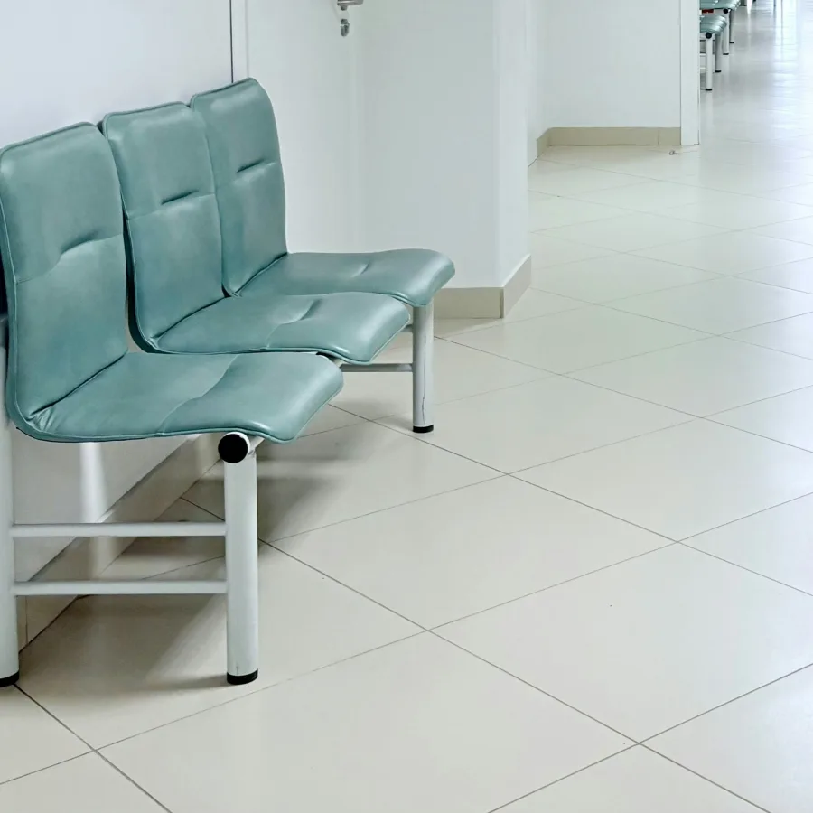 Empty waiting chairs in a bright corridor