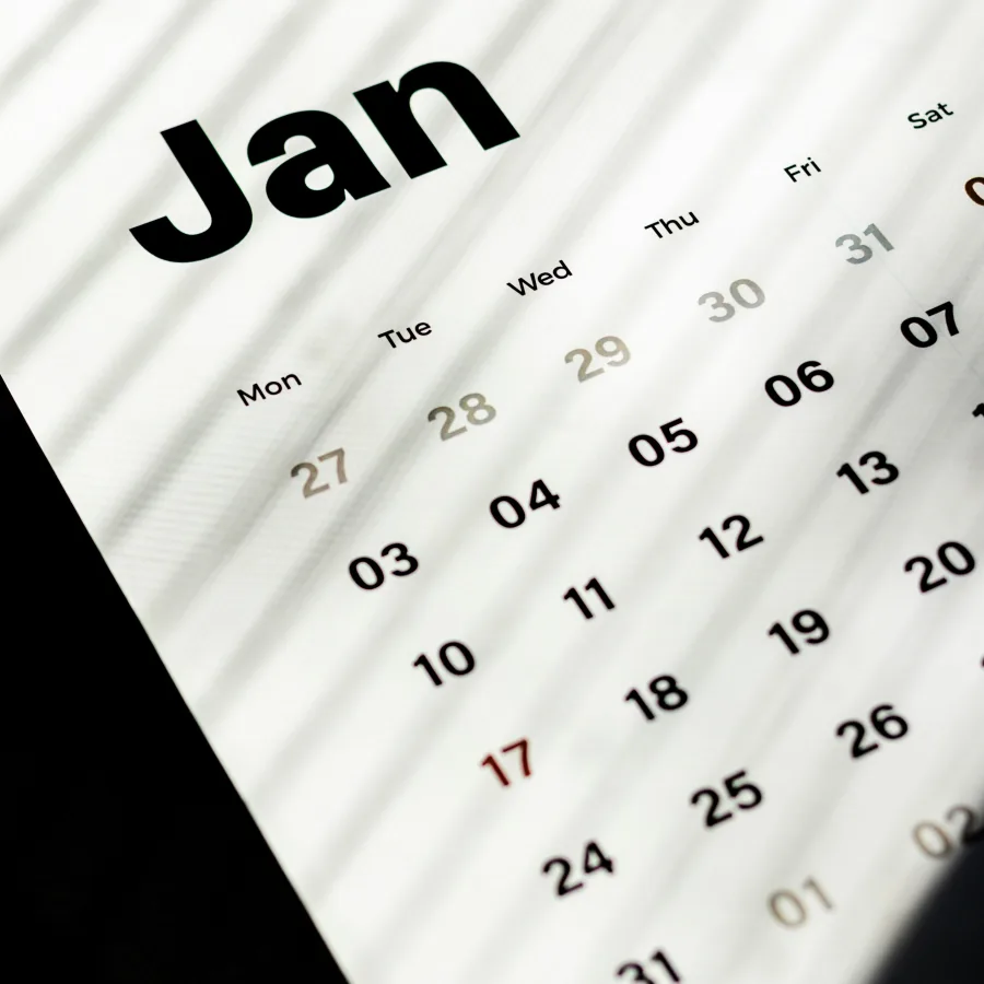 A January calendar photographed close up in raking light