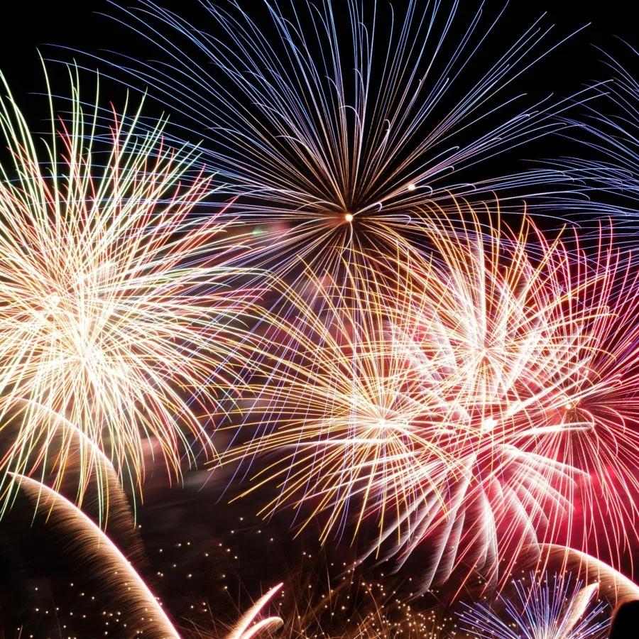 Fireworks bursting in many colours against a night sky