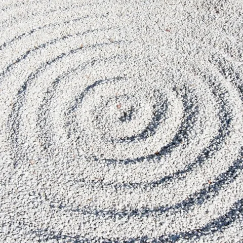 Spiral pattern raked into gravel, zen garden