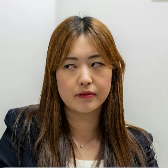 Young woman glancing suspiciously to one side