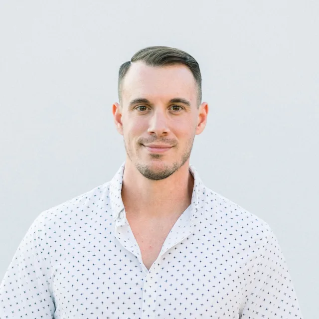 Man in a light shirt, standing, looking straight ahead